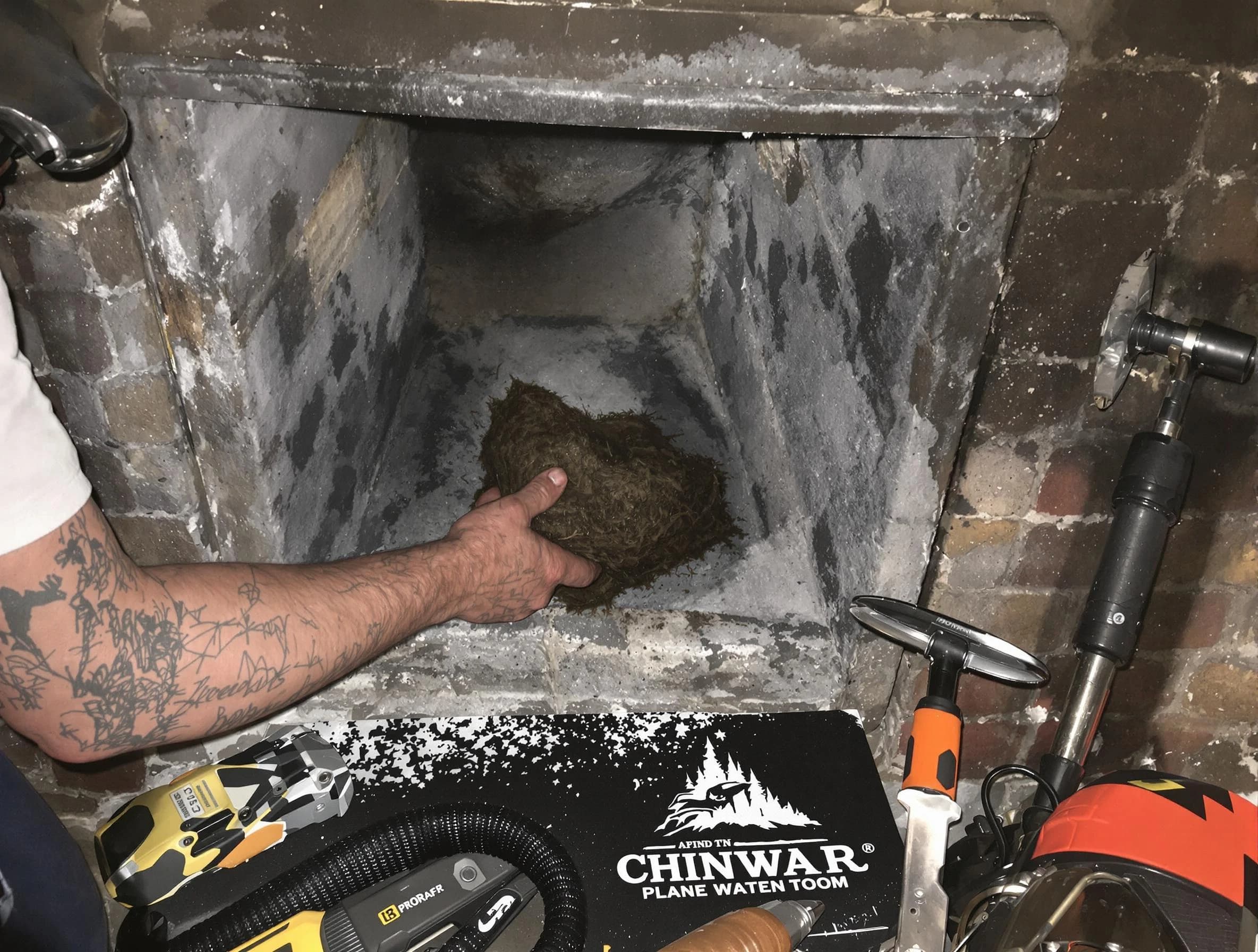Lewisburg Chimney Sweep safely removing debris and screening chimney in Lewisburg, TN